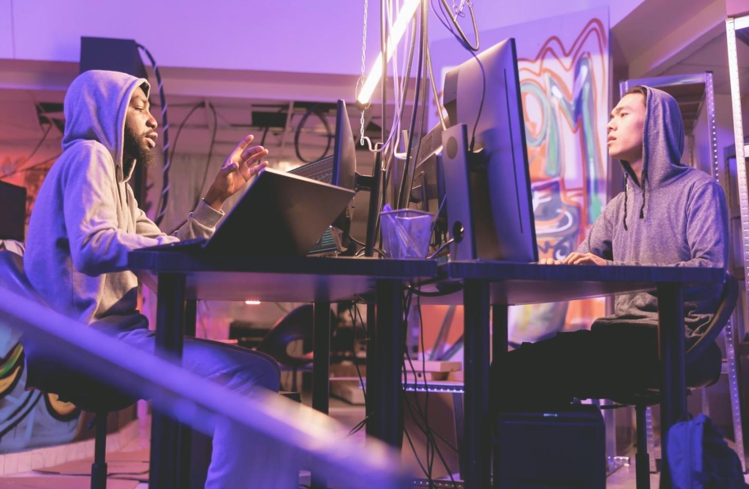 Developer reviewing mobile app code and testing procedures